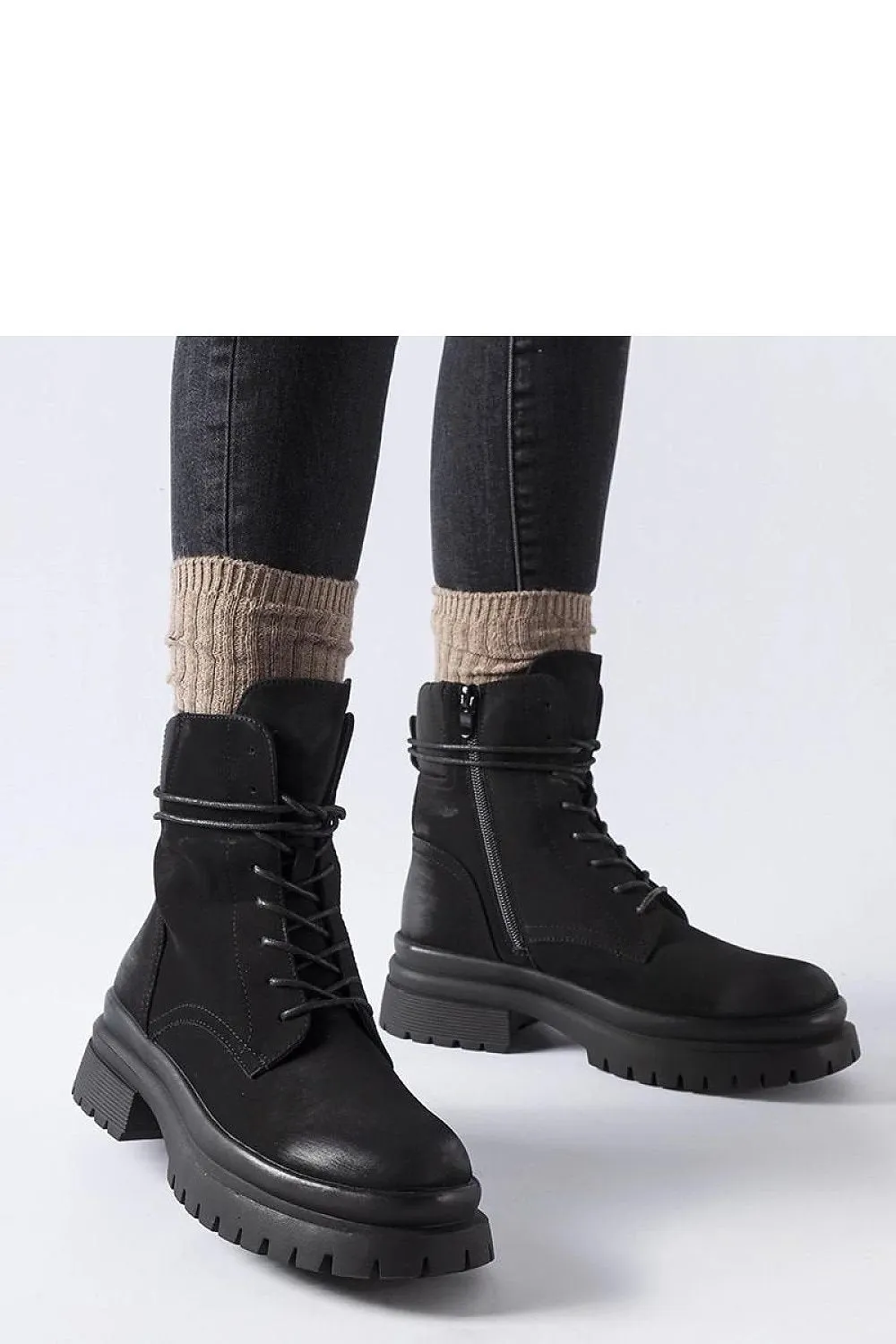 Black sneakers with a worn toe