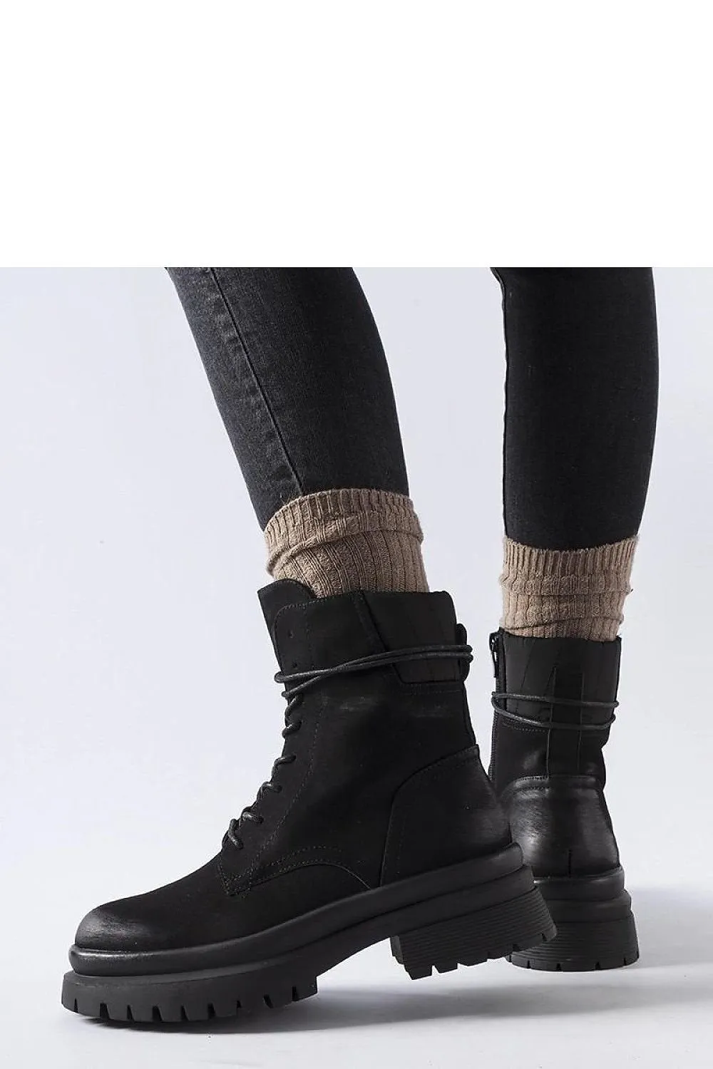 Black sneakers with a worn toe