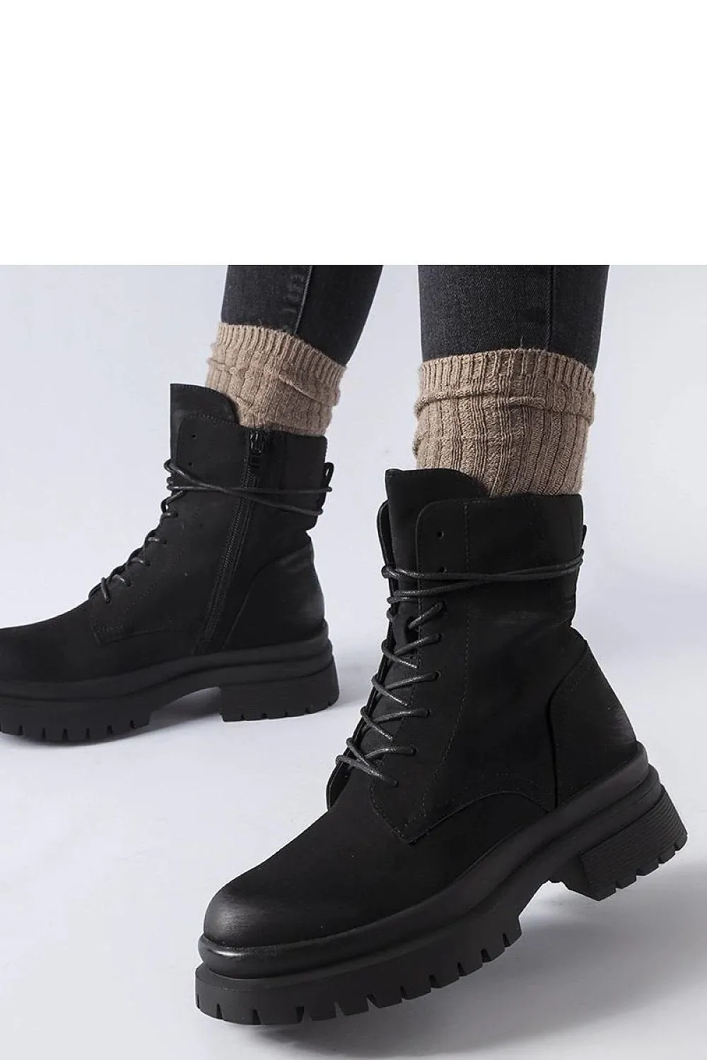 Black sneakers with a worn toe