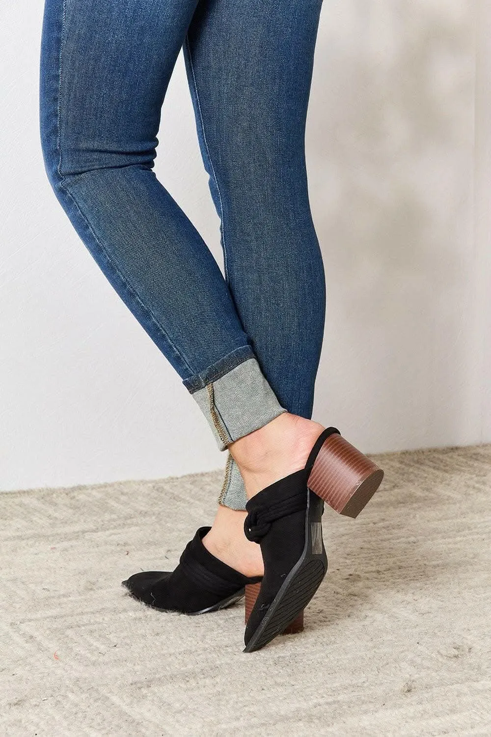Sophisticated braided mid-heel mules