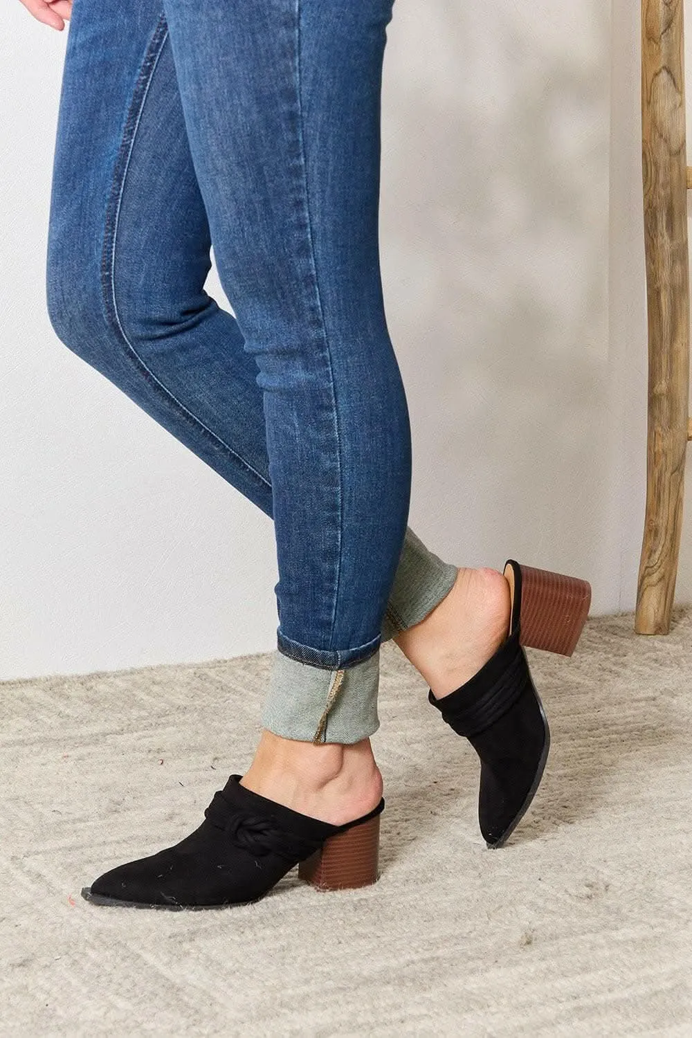 Sophisticated braided mid-heel mules