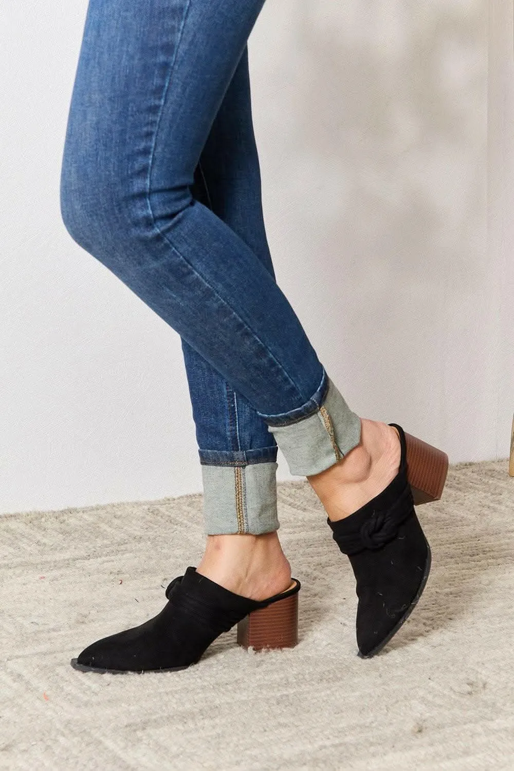 Sophisticated braided mid-heel mules